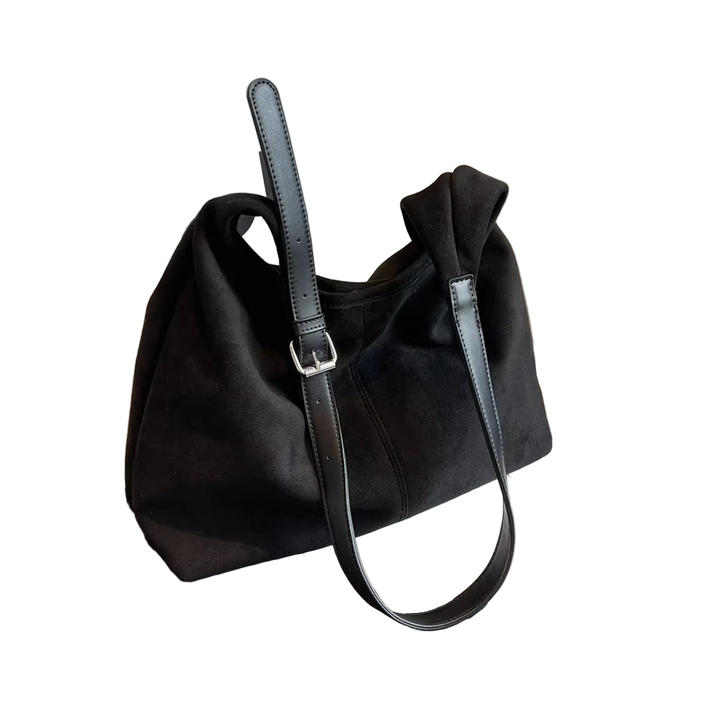 Praktisk dameveske med topphåndtak og justerbar skulderstropp for elegant crossbody- eller skulderveskestil.