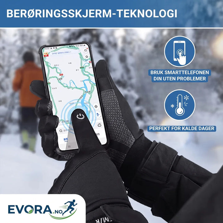 Grå og svarte vinterhansker med fleecefôr, vindtette og varme. Perfekte for kalde dager og friluftsliv.