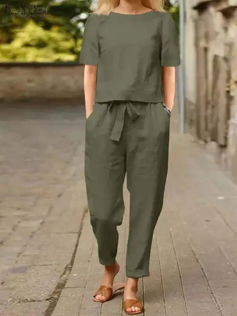 Stilrent linsett for dame, bestående av ledig bluse og luftig haremsbukse, perfekt for sommerdager.