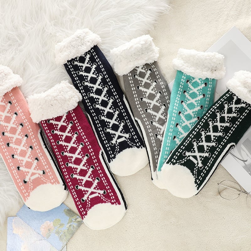 Koselige tøffelsokker, unisex design, med antiskli for trygge og avslappede steg.