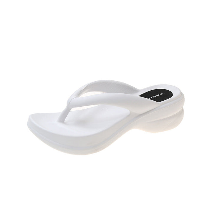 Toppvisning av komfortable kvinner's flip-flops, med bred reim og tykk, støttende såle.