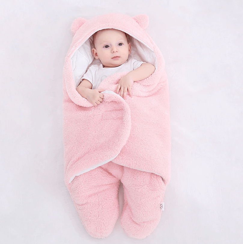 Åpen baby sovepose i ull som viser det myke fôret inni.