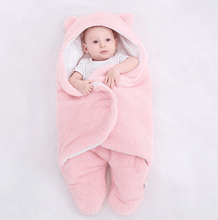 Åpen baby sovepose i ull som viser det myke fôret inni.