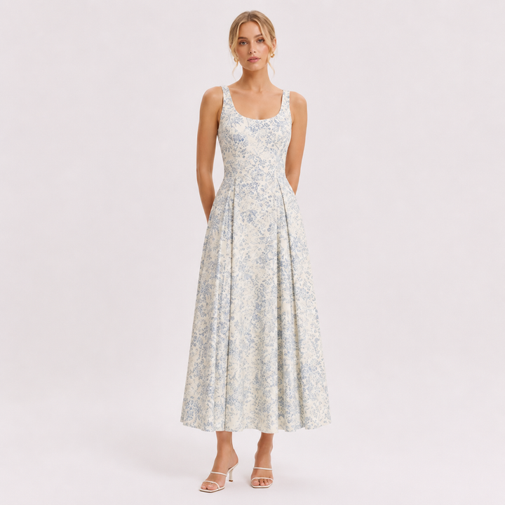 Elegant blomstret midikjole med spaghettistropper for dame, perfekt som sommerkjole eller festkjole.