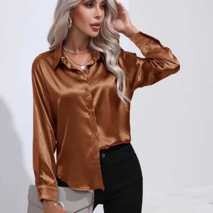 Festtopp: elegant damebluse med løs passform og lange ermer for kvinner.