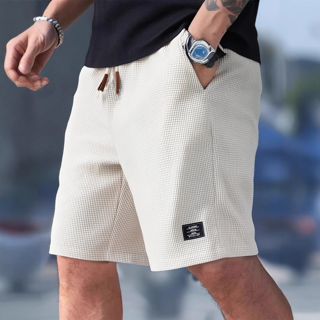 Menns shorts med snøring, ideell for både trening, sport og avslappet hverdagsbruk. Komfortabel med lommer.