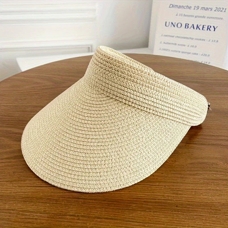 Elegant dame solhatt, foldbar og pustende. Ideell for strand, hage og solbeskyttelse.