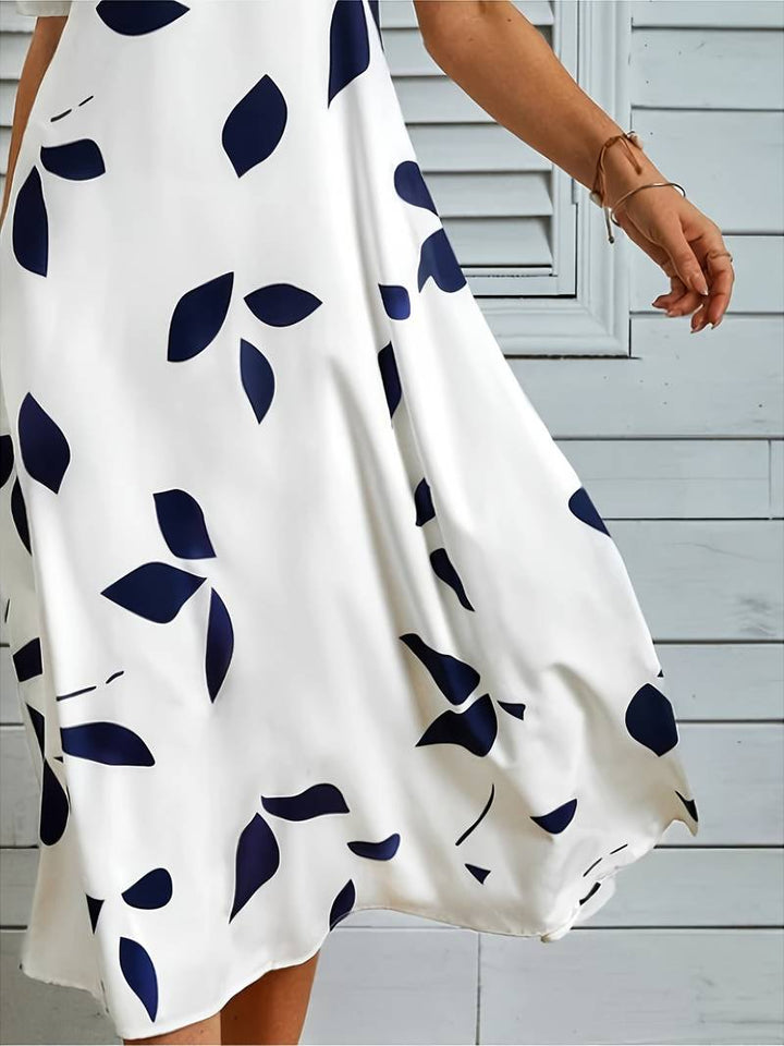 Komfortabel hvit midi kjole for damer, elegant og tidløs. Perfekt pen kjole for både fest og hverdag. Kvinne mote.