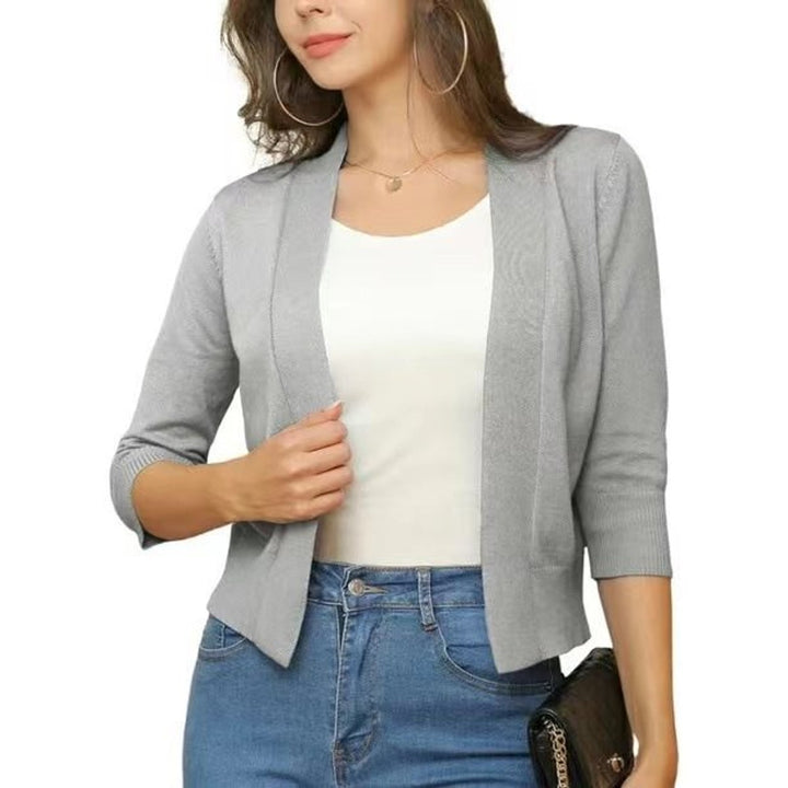 Trendy damecardigan med 3/4-ermer og åpen front, enkel å style for enhver anledning.