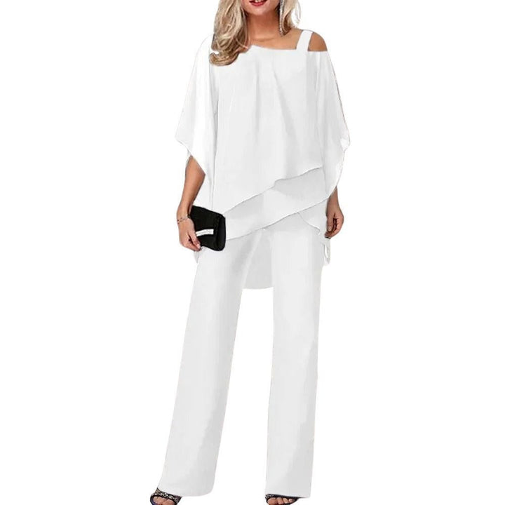 Stilfull kvinne festdrakt i lett chiffon, med flaggermusermer for en elegant og formell look.