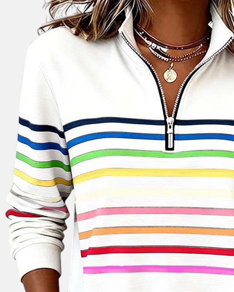 Komfortabel dame sweatshirt, fargerikt stripet mønster, glidelås, og myk kvalitet.