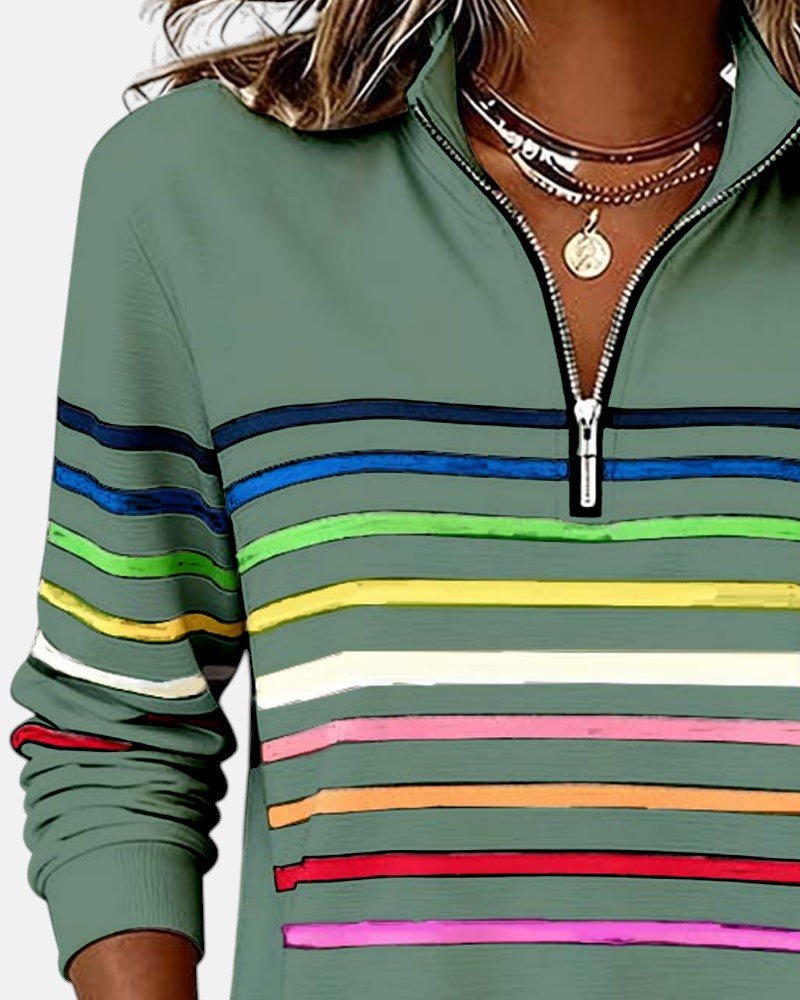 Komfortabel dame sweatshirt med striper i regnbuefarger og praktisk glidelås.