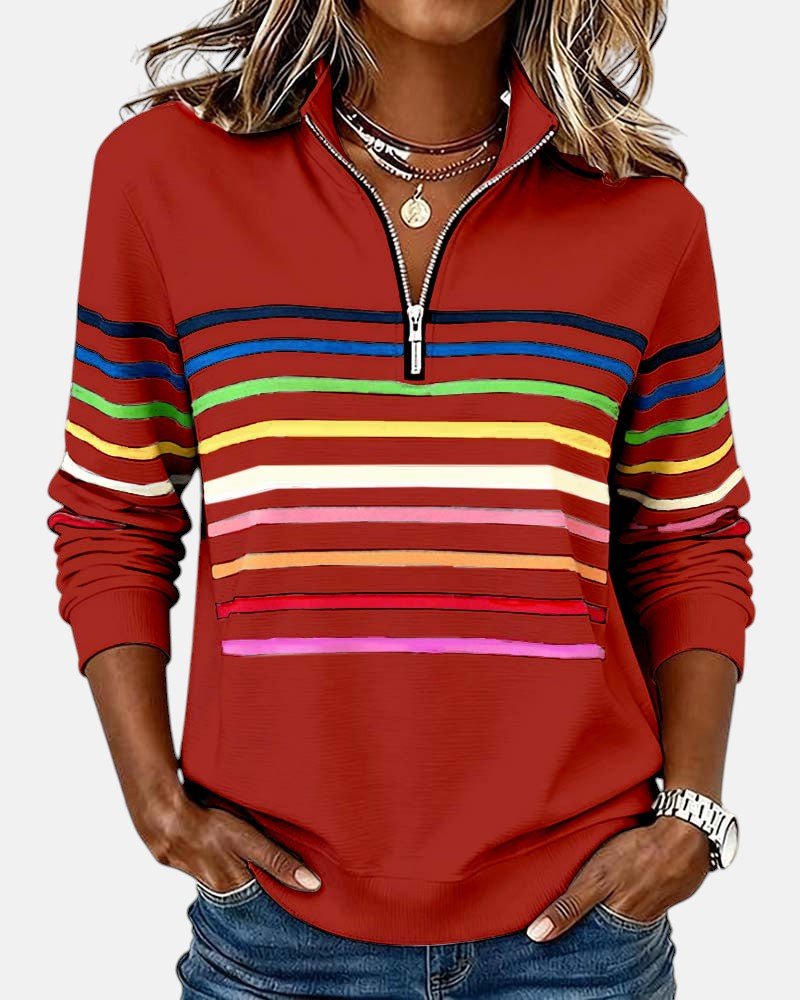 Avslappet og fargerik dame sweatshirt med glidelås og brede regnbuestriper.