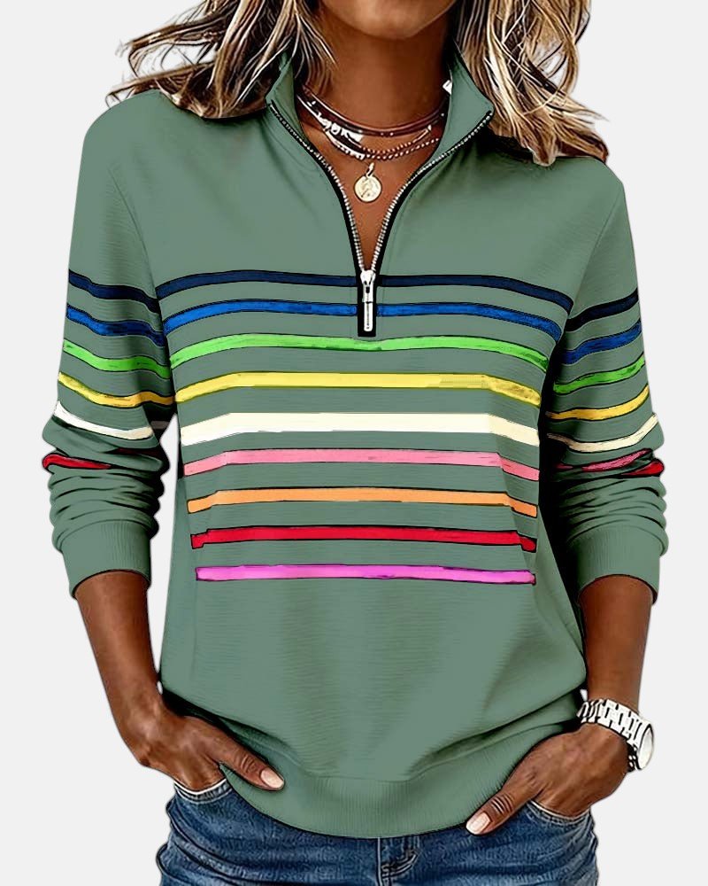 Hverdagssweatshirt for dame, fargerike striper, glidelås i halsen, myk og avslappet passform.