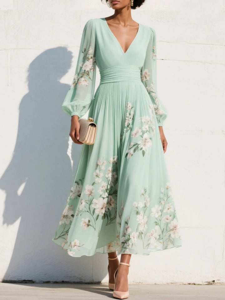 Elegant blomstrete midi kjole for kvinner med V-hals og trendy ballongermer, perfekt for fest og bryllupsgjest.