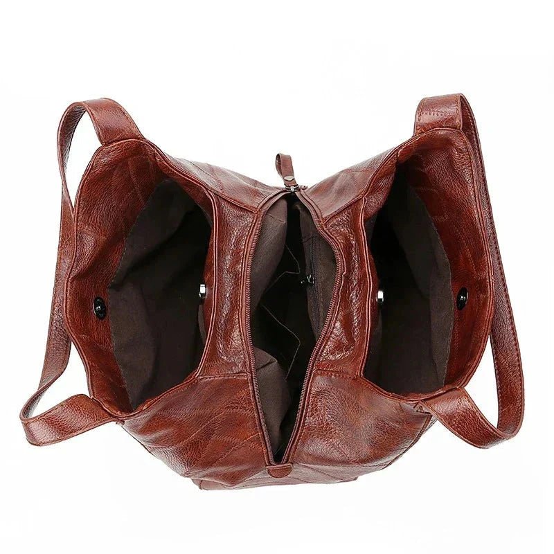 Vintage lær dame hobo skulderveske, romslig og komfortabel med klassisk appell.