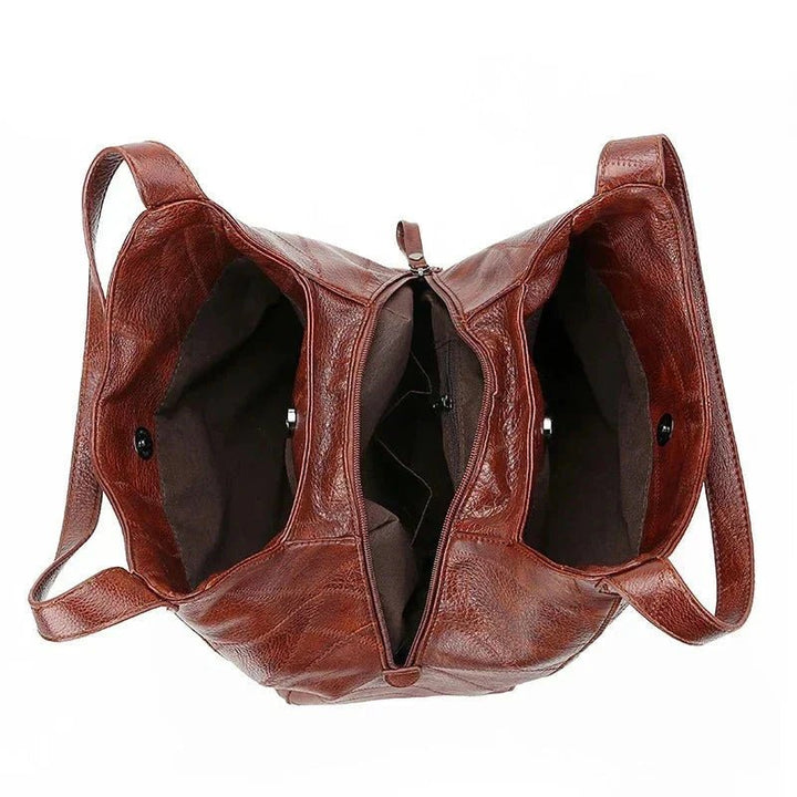Vintage lær dame hobo skulderveske, romslig og komfortabel med klassisk appell.