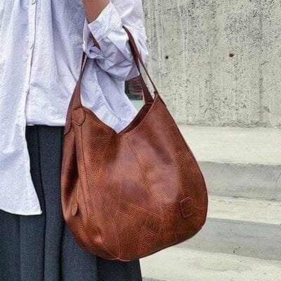Klassisk brun dame hobo veske i vintage lær, romslig og elegant design.