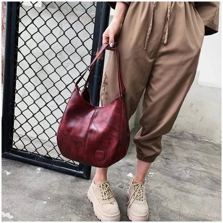 Myk vintage lær hobo skulderveske for dame, romslig og holdbar i elegant bruntone.