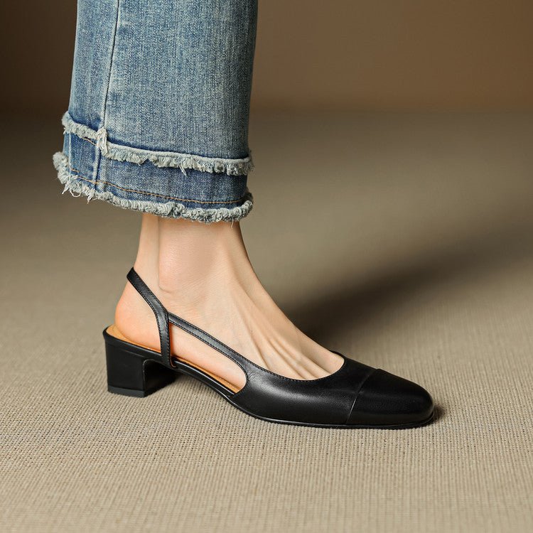 Nærbilde av den elegante mandeltåen på klassiske slingback pumps i sort skinn.