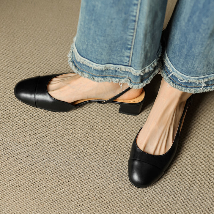 Trendy slingback pumps med moderne blokkhæl og tidløs mandeltå, perfekt for kvinner.