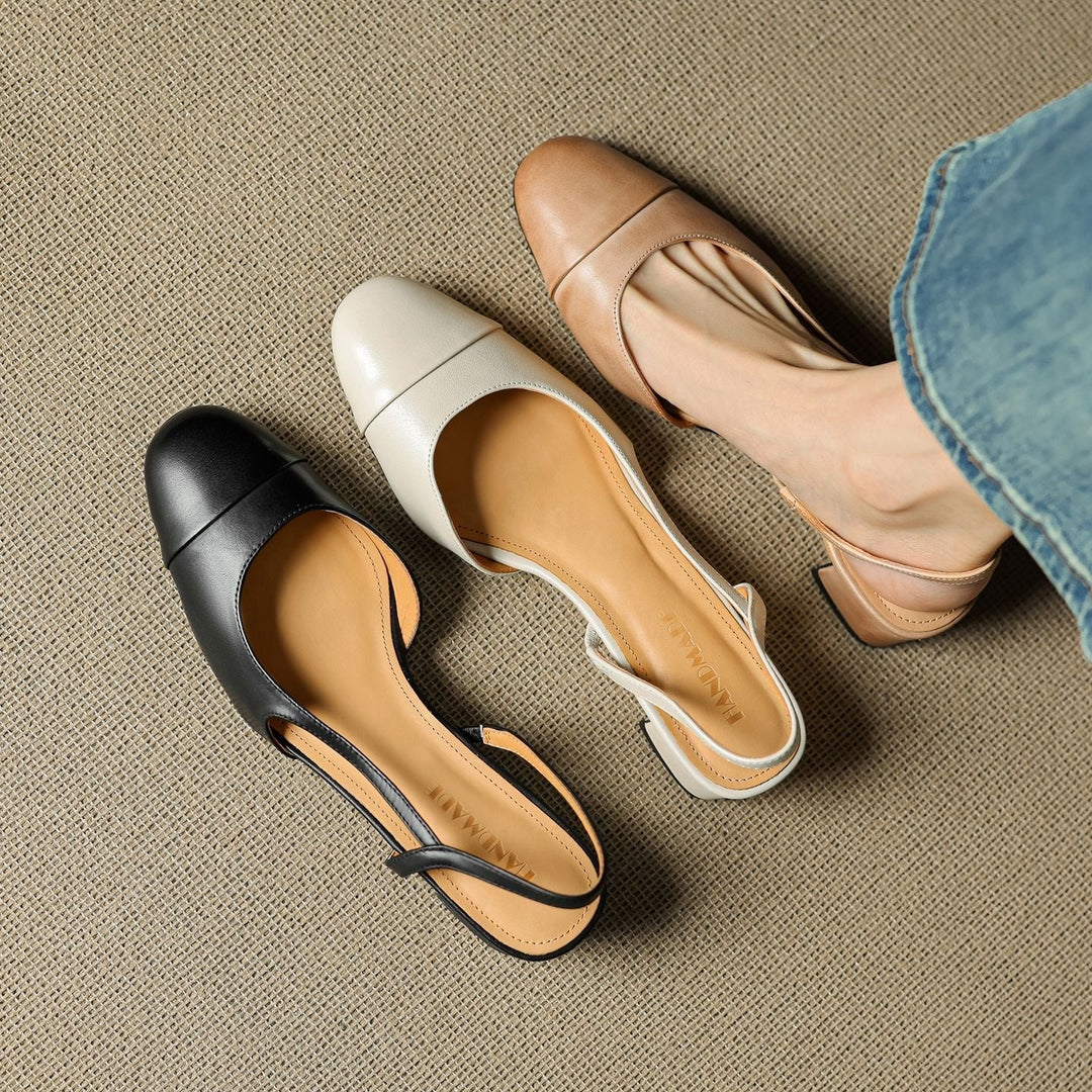 Røde slingback pumps i semsket skinn med elegant mandeltå, perfekt for å løfte antrekket.