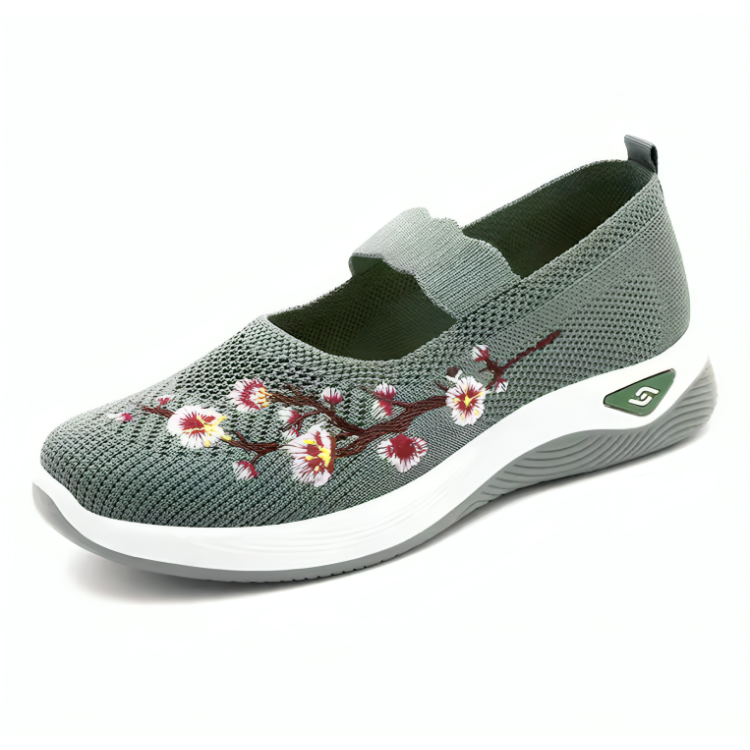 Elegante damesko med blomsterbroderi, mesh-overdel og støtdemping. Perfekte komfortsko for fritid.