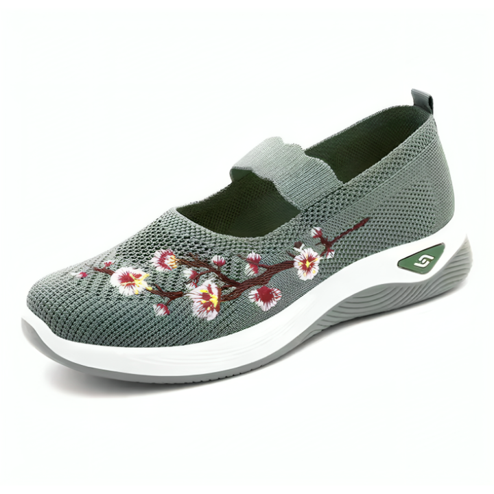 Elegante damesko med blomsterbroderi, mesh-overdel og støtdemping. Perfekte komfortsko for fritid.