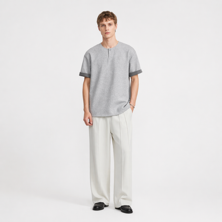 Herre Henley t-skjorte med rutete detaljer og løs passform. Ideell for casual streetwear.