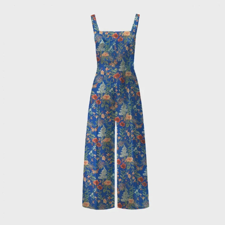Kvinne viser frem en chic blomstret vidbeins selebukse, ideell for en stilig look.