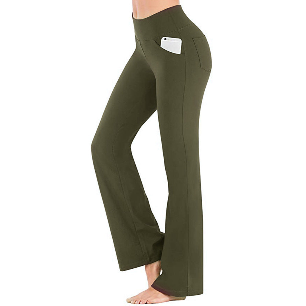 Detalj av høy midje på komfortable bootcut yogabukser for dame, som gir god støtte.