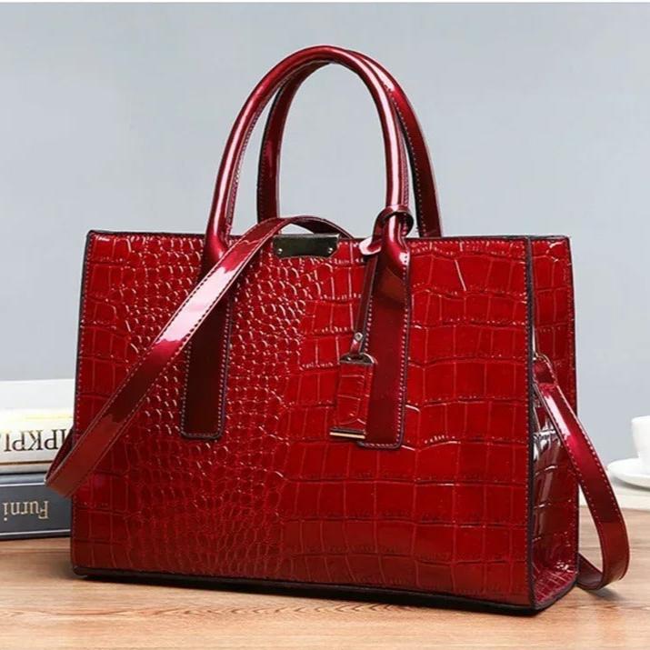 Romslig brun toteveske med krokodilletrykk for dame. Ideell for hverdagsbruk og som en elegant detalj.