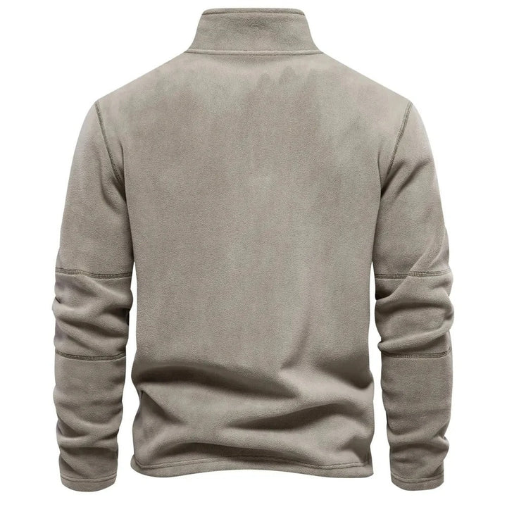 Elegant menns vintergenser med halv glidelås, perfekt for en stilren og varm look i kaldt vær.