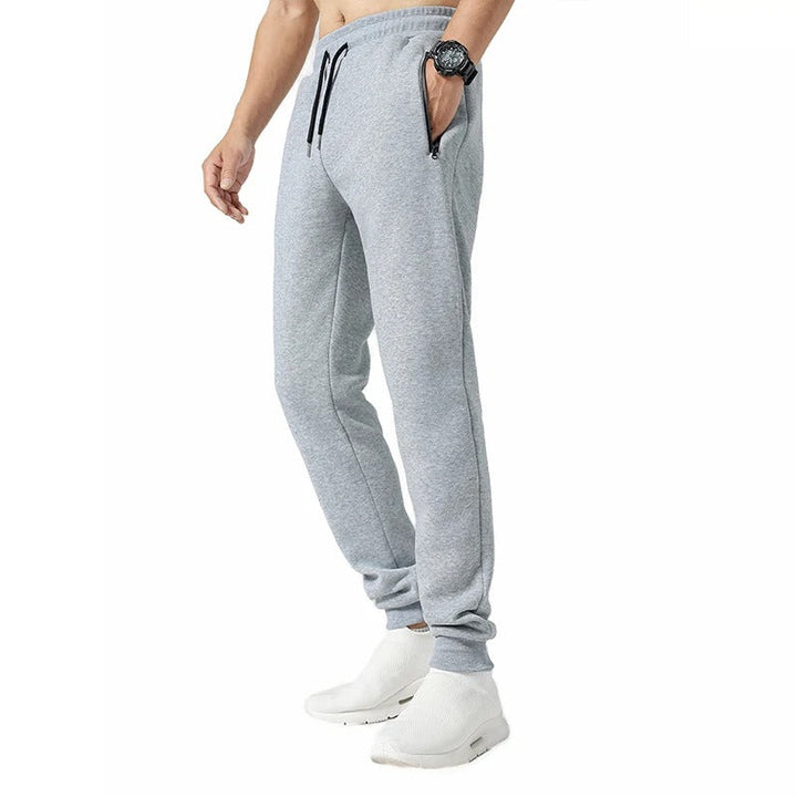 Komfortable menns joggebukser med ribbestrikkede mansjetter, ideell for en sporty look.
