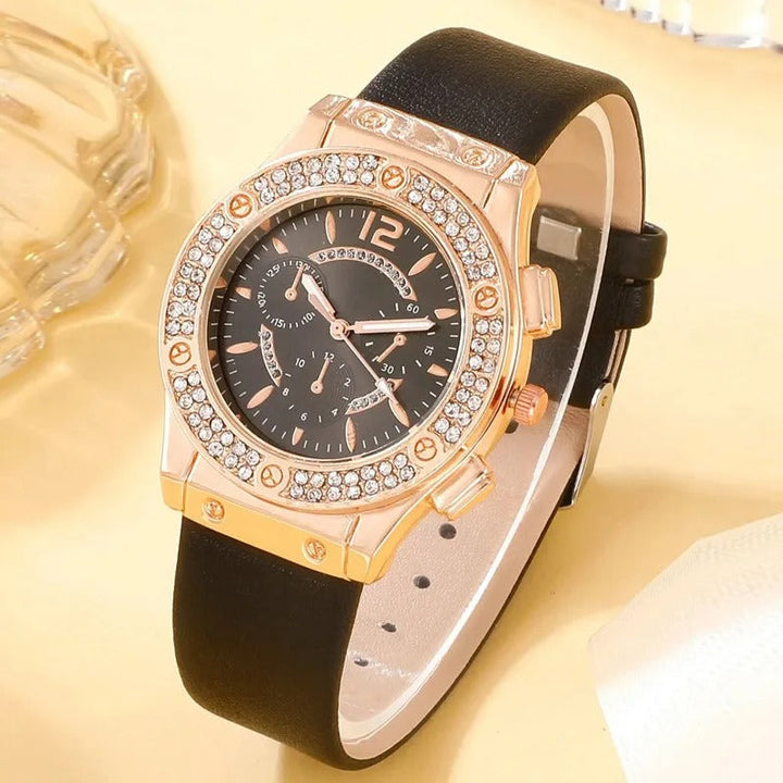 Nærbilde av luksus dameklokke med rhinestone-dekor og kvartsurverk. Stilrent armbåndsur.