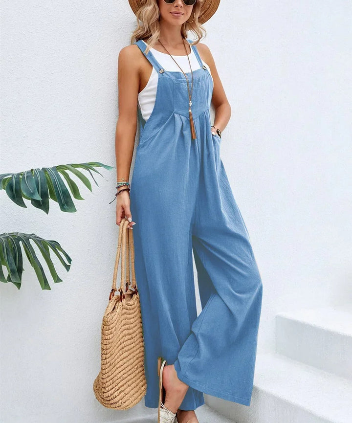 Trendy kvinner baggy bib jumpsuit stylet med genser, løs passform, vide ben, uformell og moderne look.