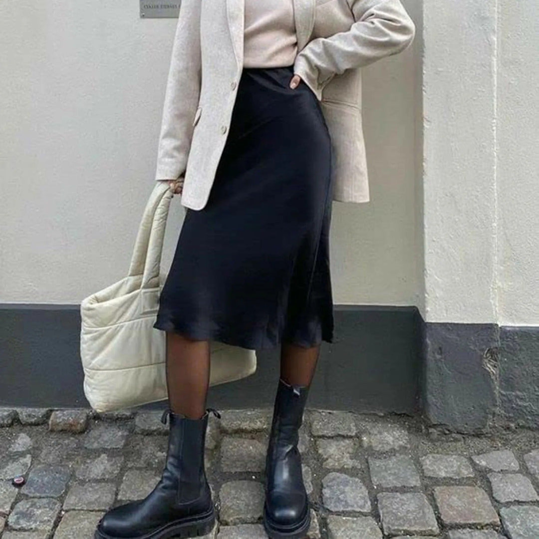 Klassisk knelangt A-linjeskjørt for kvinner. Elegant og komfortabelt for jobb eller fest.
