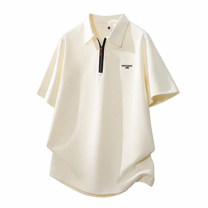 Elegant herre polo skjorte i grå, med half placket og pustende strikket stoff. Komfortabel passform for business casual.