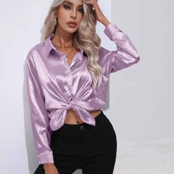 Allsidig langermet bluse med elegant design, ideell for fest og hverdag.