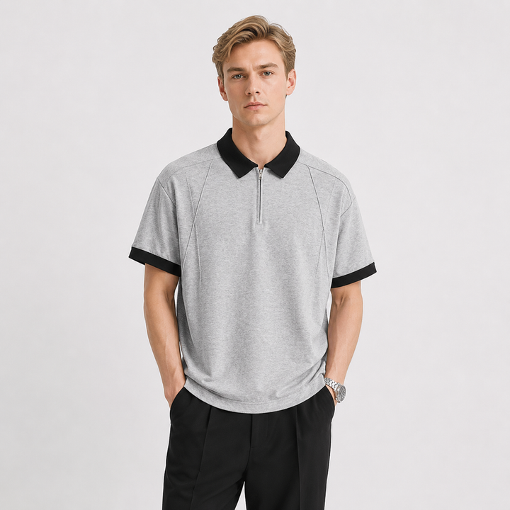 Herre kortermet half-zip pikéskjorte med elegant kontrastkrage. Komfortabel bomullspolo for vår og sommer.