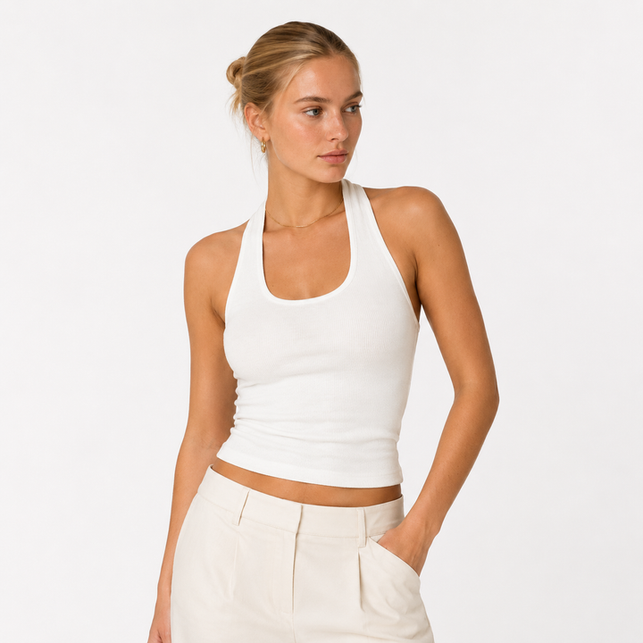 Stilren ryggløs halter crop topp for dame, tilgjengelig i hvit og svart. Elegant og trendy sommermote.