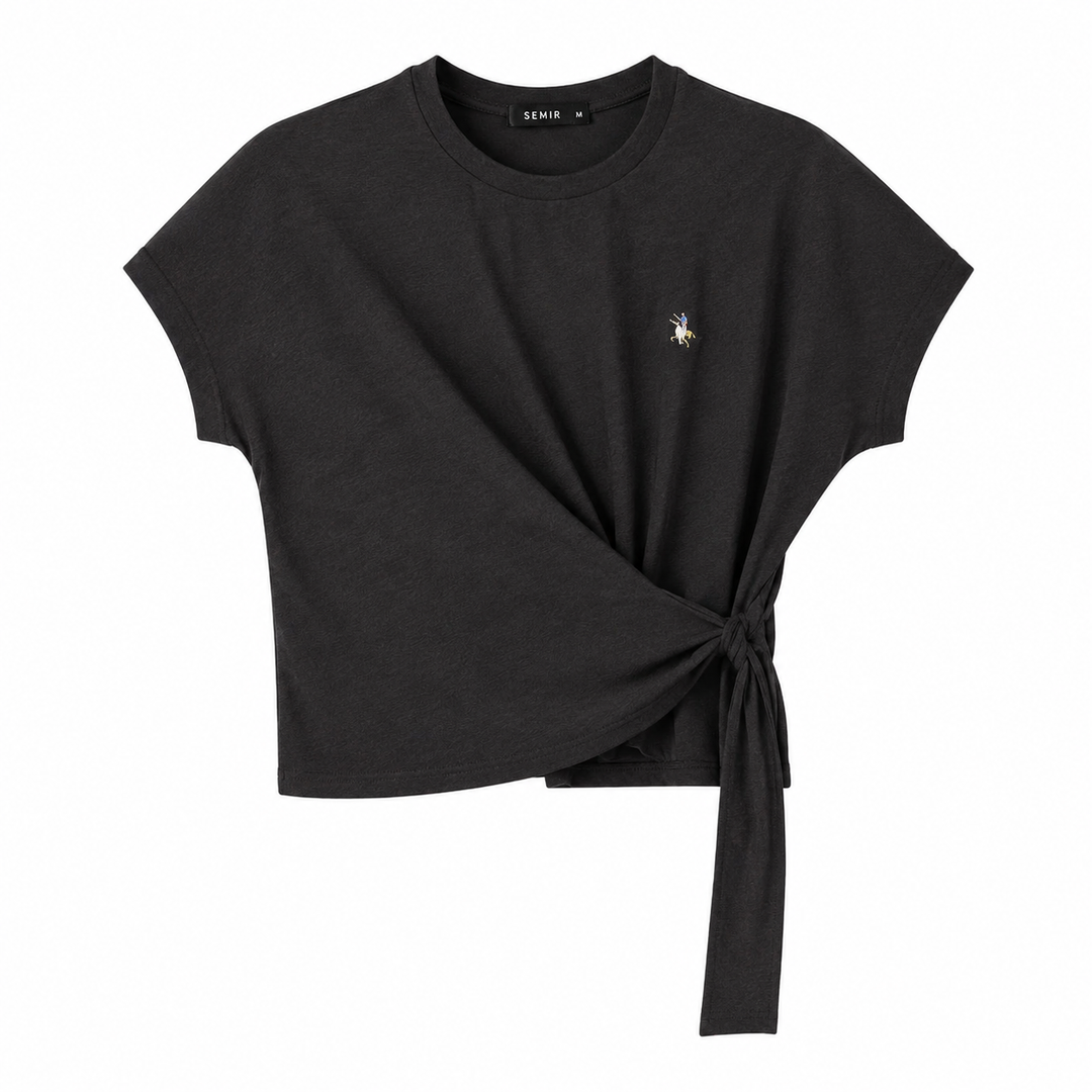 Trendy langermet dametopp med asymmetrisk snitt og unikt sjøstjerneprint. Ideell for avslappet sommermote.