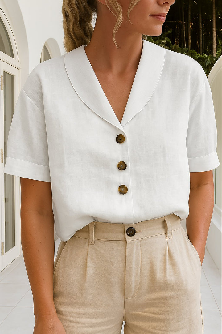 Elegant damebluse med innviket V-hals, korte ermer. Perfekt for sommer, hverdag og fest. Stilrent design.