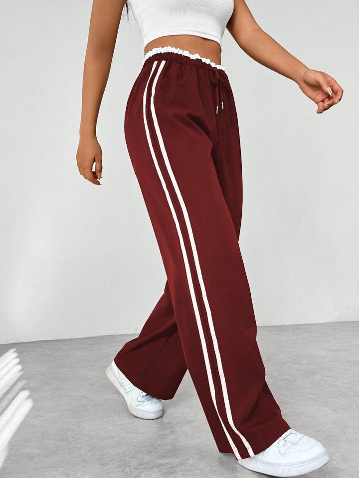 Komfortable vide damebukser i sporty stil med høy midje, ideelle for motebevisst fritid.