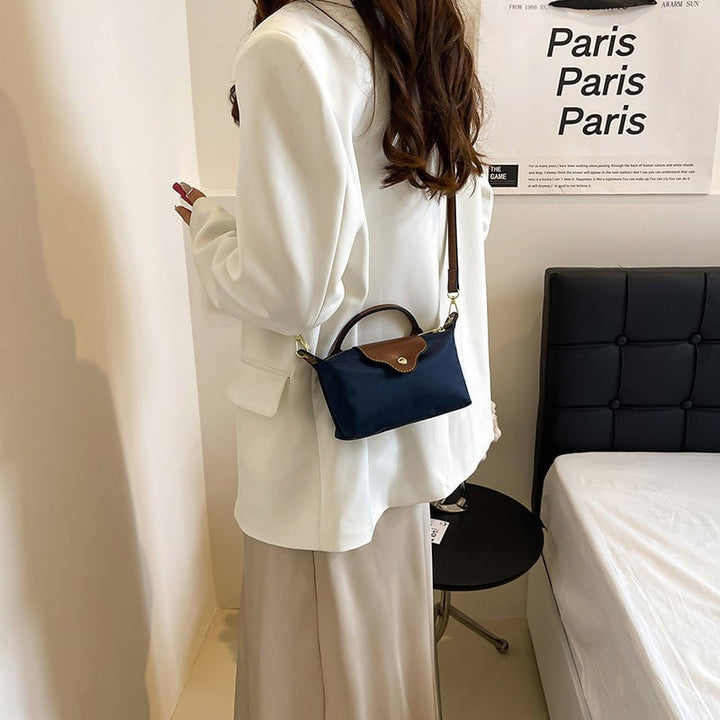 Trendy kvinners fargeblokk crossbody veske, kompakt og stilfull for daglig bruk.