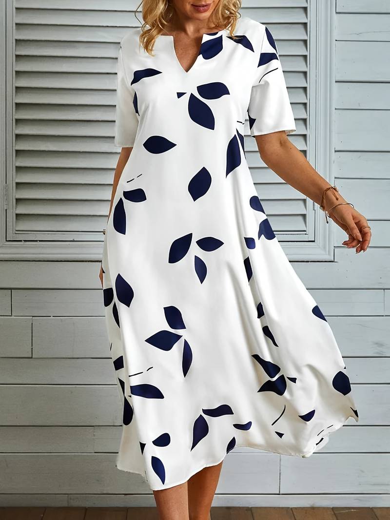 Pen hvit damekjole, elegant og feminin. En tidløs midi sommerkjole i klassisk stil for moderne kvinner.