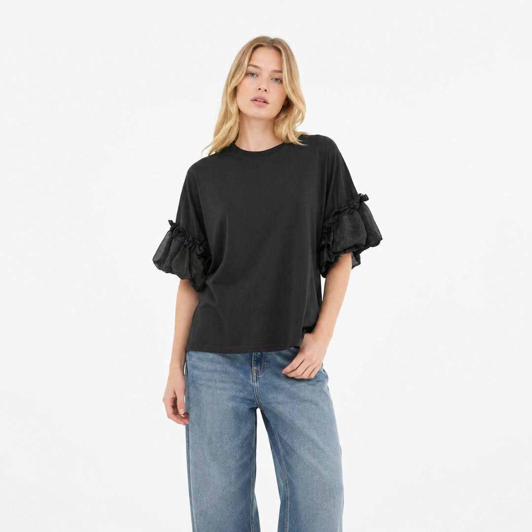 Elegant dametopp med løs passform og voluminøse lantern-ermer for komfortabel, feminin stil.