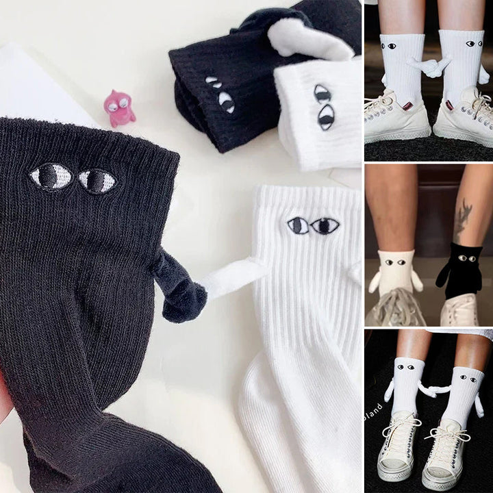 Svarte og hvite unisex magnetiske sokker, stilige og morsomme for par som matcher.
