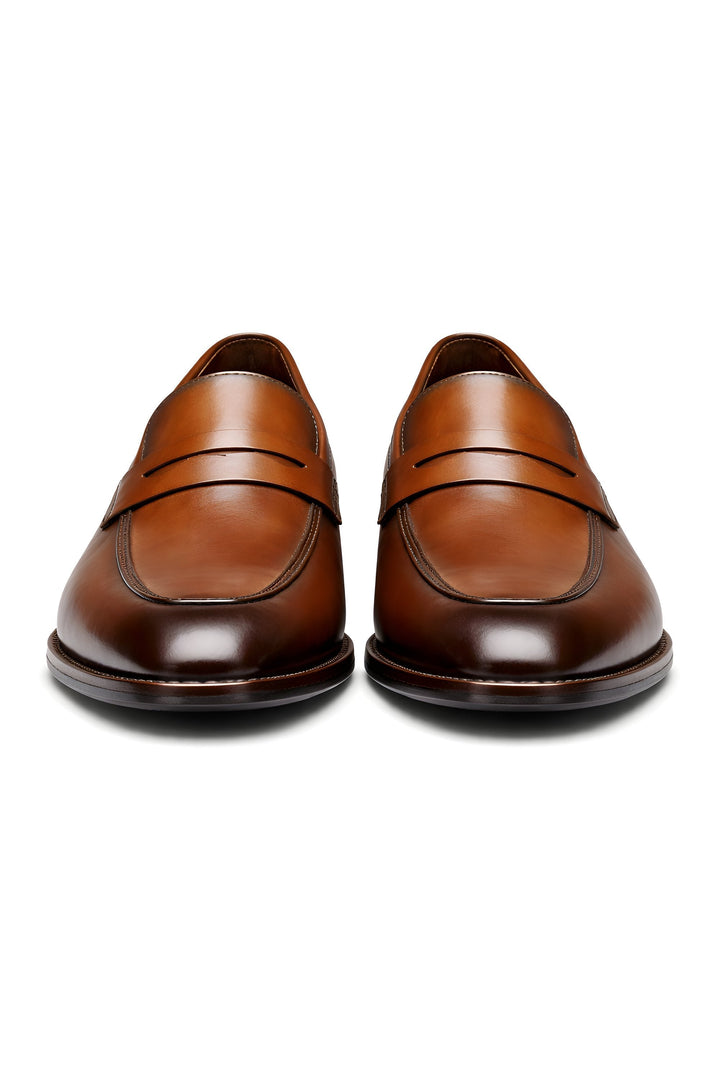 Detaljert bilde av tekstur på klassiske herre penny loafers, premium skinn og solid utførelse.