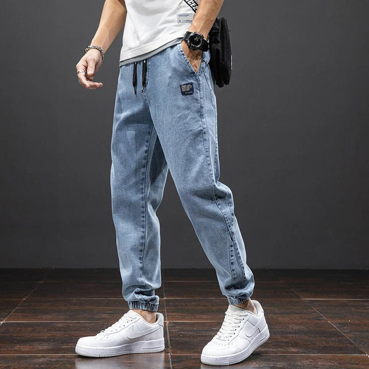 Herres stretch denim joggebukser med elastisk midje, avslappet passform for hverdagsbruk og komfort.